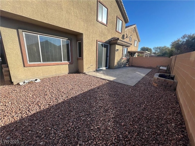 rear view of house with a patio