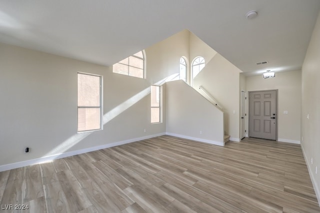 unfurnished living room featuring light wood-type flooring