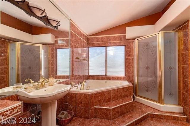 bathroom with separate shower and tub, tile walls, tile patterned floors, and lofted ceiling