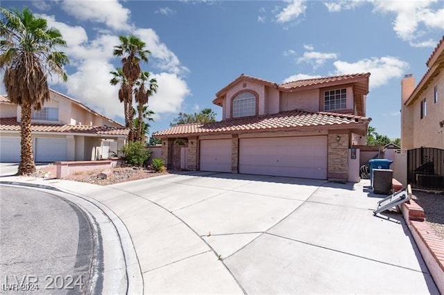 mediterranean / spanish-style house featuring a garage