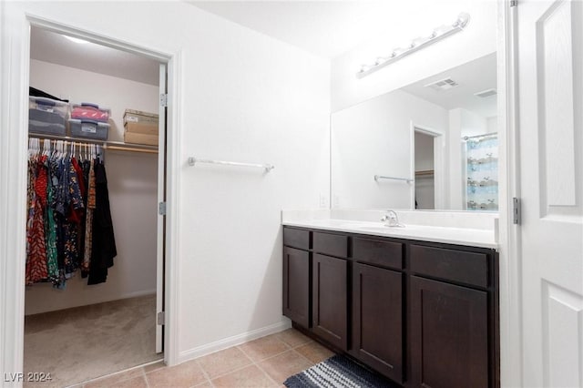 bathroom featuring tile patterned floors and vanity