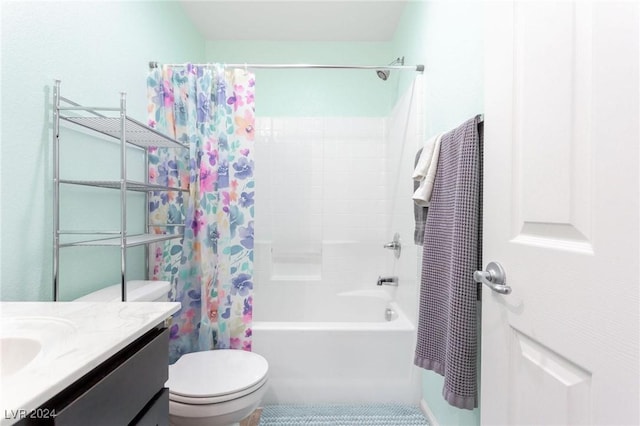 full bathroom with toilet, vanity, and shower / tub combo with curtain