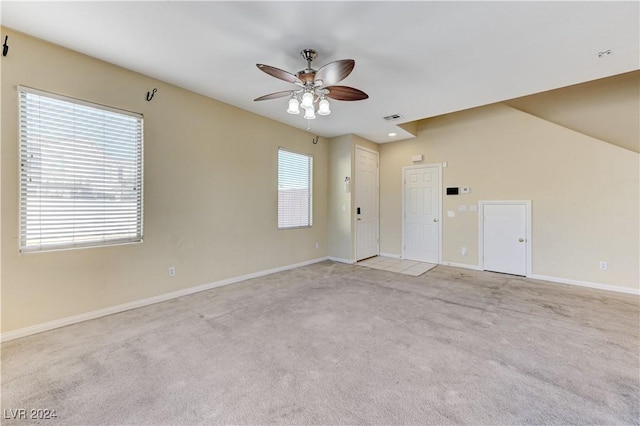 carpeted empty room featuring ceiling fan