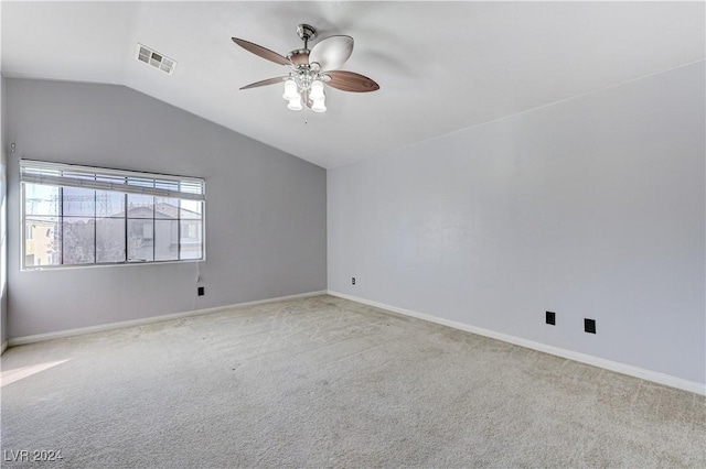 unfurnished room featuring ceiling fan, light colored carpet, and lofted ceiling