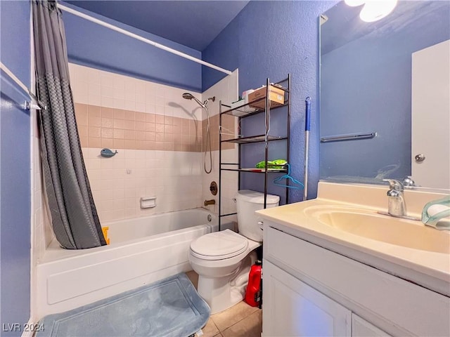 full bathroom featuring toilet, vanity, tile patterned floors, and shower / bath combo with shower curtain