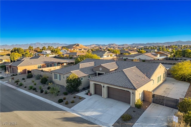 birds eye view of property with a mountain view