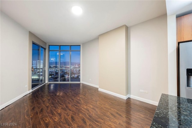 200 W Sahara Ave Unit 1510, Las Vegas, NV 89102 - unfurnished room featuring wood finished floors, floor to ceiling windows, and a view of city