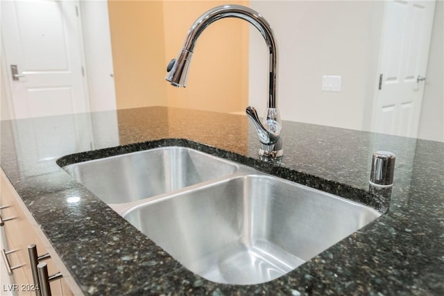 200 W Sahara Ave Unit 1510, Las Vegas, NV 89102 - kitchen view of a sink and dark stone countertops