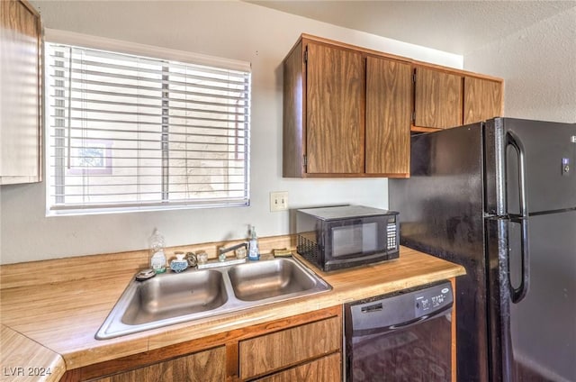 kitchen featuring sink and black appliances