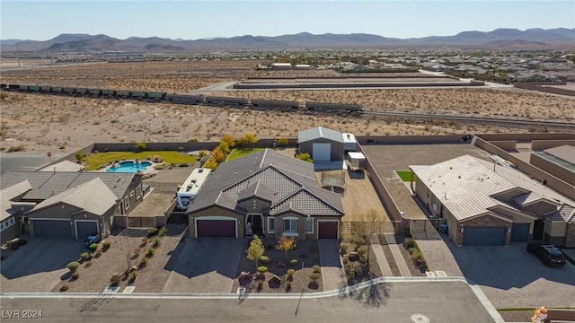 birds eye view of property featuring a mountain view