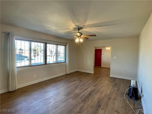 spare room featuring ceiling fan, hardwood / wood-style floors, and a textured ceiling