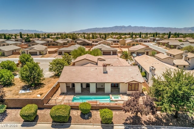 drone / aerial view featuring a mountain view