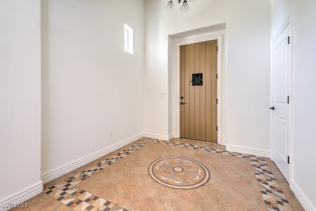 foyer featuring light tile patterned floors