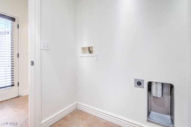 washroom featuring washer hookup, light tile patterned floors, and electric dryer hookup