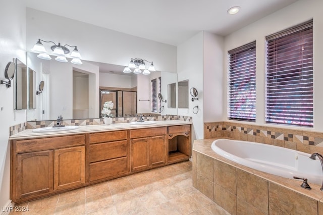 bathroom featuring tile patterned floors, vanity, and independent shower and bath