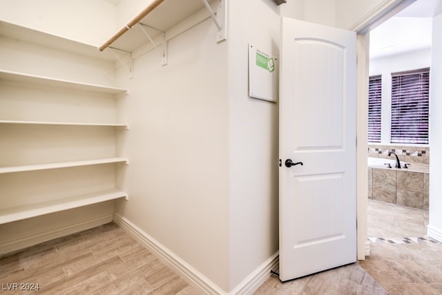 spacious closet with light wood-type flooring