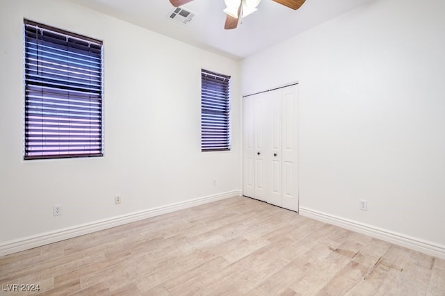 unfurnished room featuring ceiling fan and light hardwood / wood-style floors