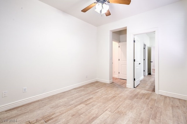 spare room featuring light hardwood / wood-style floors and ceiling fan