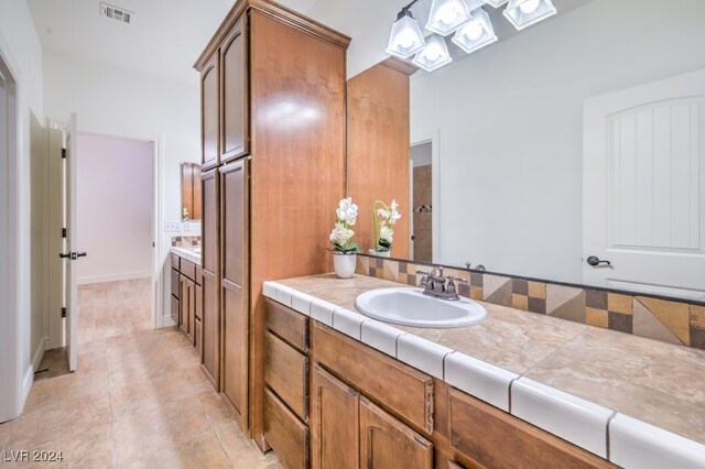 bathroom featuring tile patterned floors and vanity