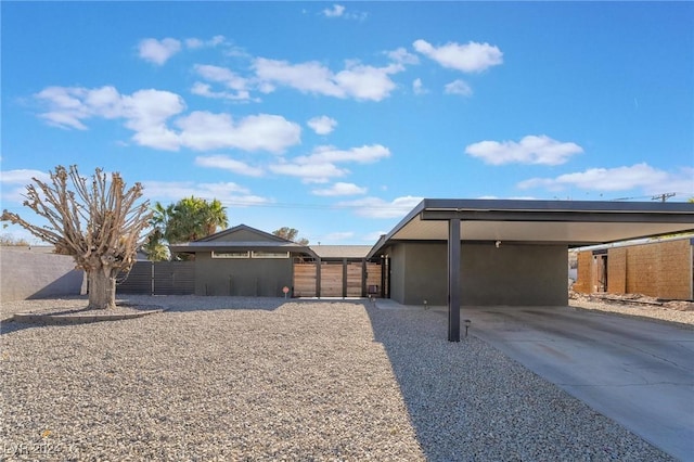 view of side of property featuring a carport