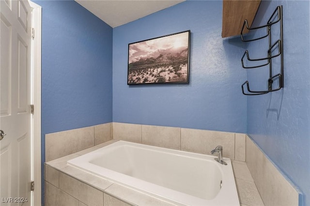 bathroom featuring tiled tub