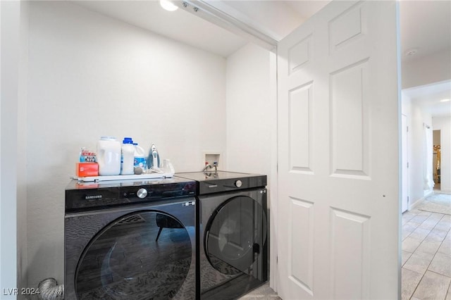 laundry area with separate washer and dryer