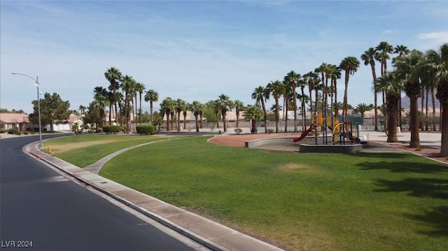 view of jungle gym featuring a lawn