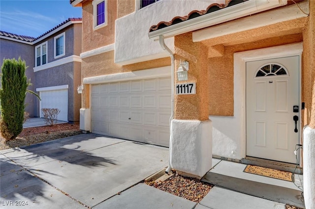 entrance to property featuring a garage