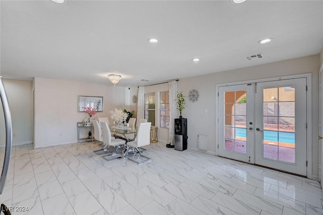 unfurnished dining area featuring french doors