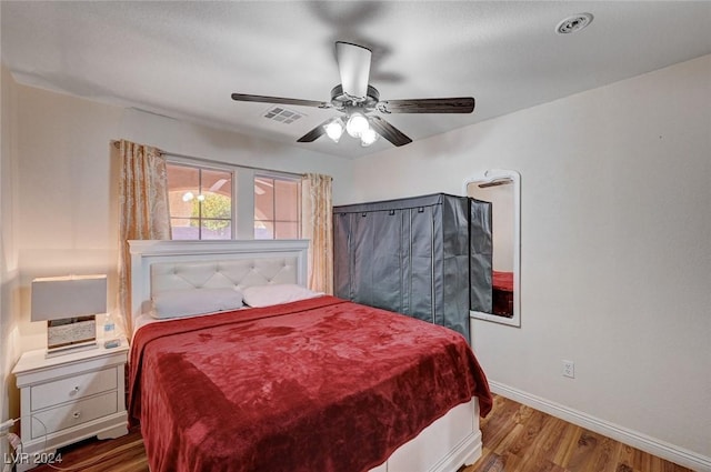 bedroom with wood-type flooring and ceiling fan