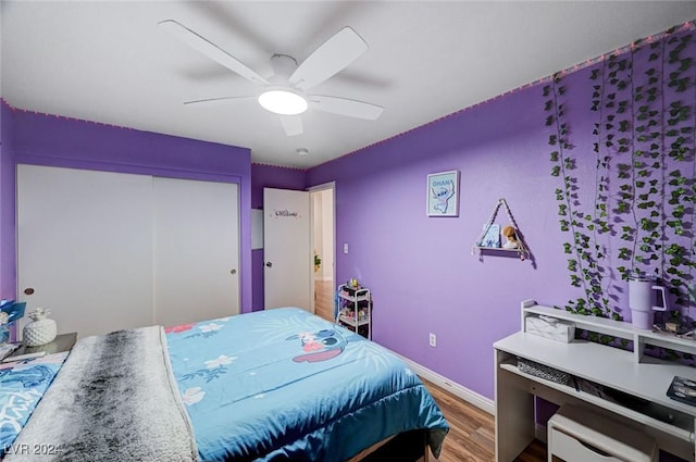 bedroom with hardwood / wood-style flooring and ceiling fan