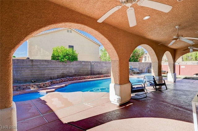 view of pool with ceiling fan and a patio area