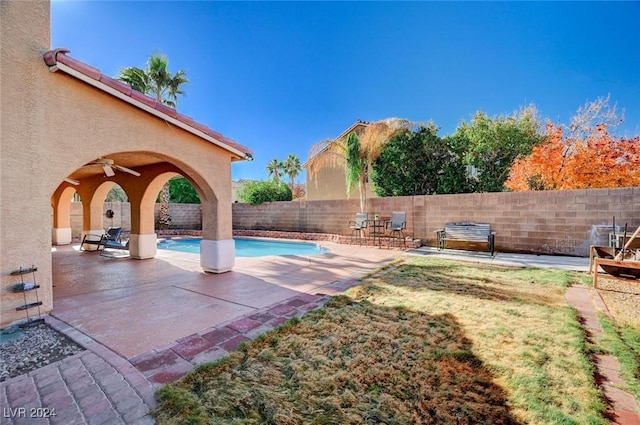 view of pool with a yard and a patio