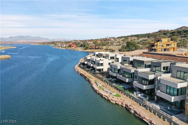 drone / aerial view with a water and mountain view