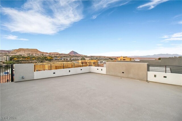 exterior space featuring a mountain view and fence