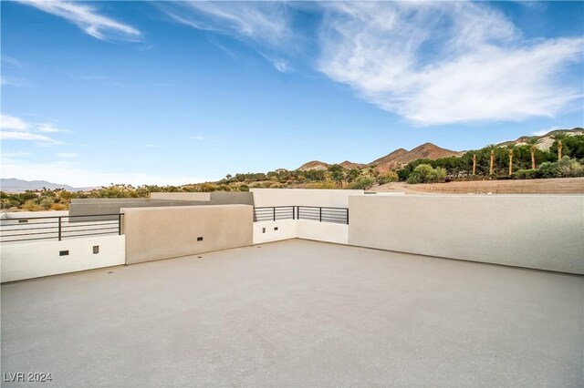 view of patio / terrace featuring a mountain view