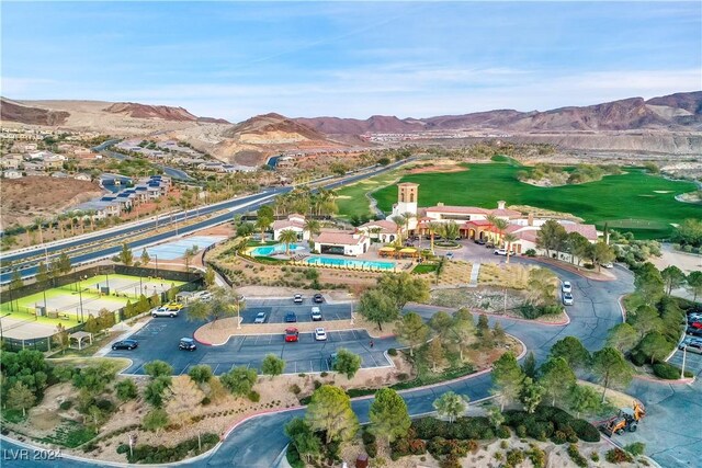 birds eye view of property with a mountain view