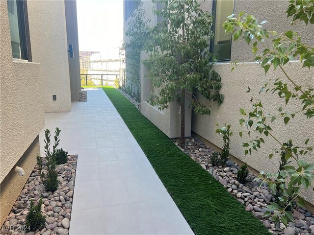 view of yard featuring a patio area and fence