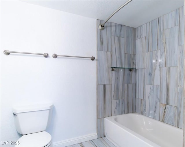 bathroom with bathtub / shower combination and toilet