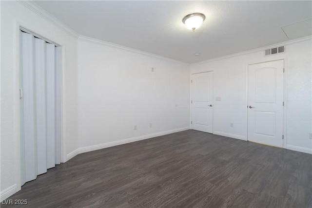 unfurnished bedroom with crown molding and dark hardwood / wood-style floors