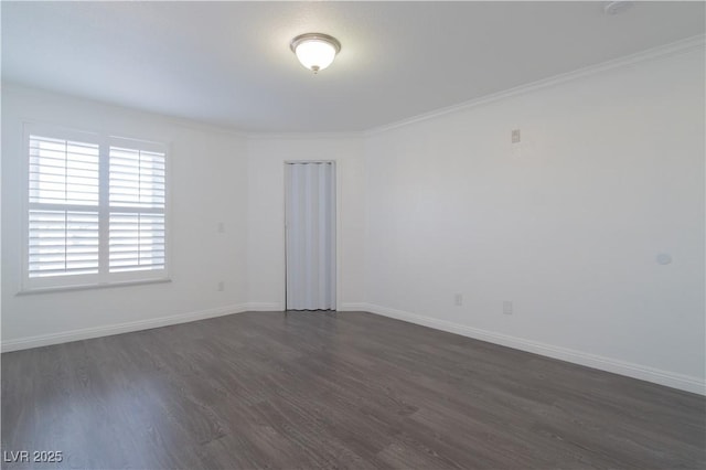 empty room with crown molding and dark wood-type flooring