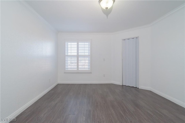 unfurnished room with dark hardwood / wood-style floors and crown molding