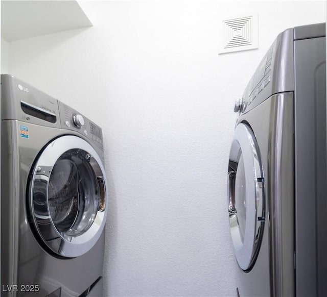 laundry area with washer / dryer