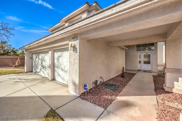 entrance to property featuring a garage