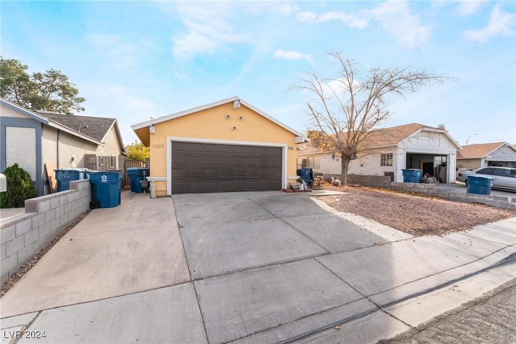 ranch-style home featuring a garage