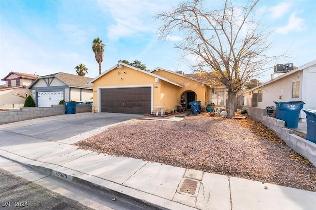 single story home with a garage