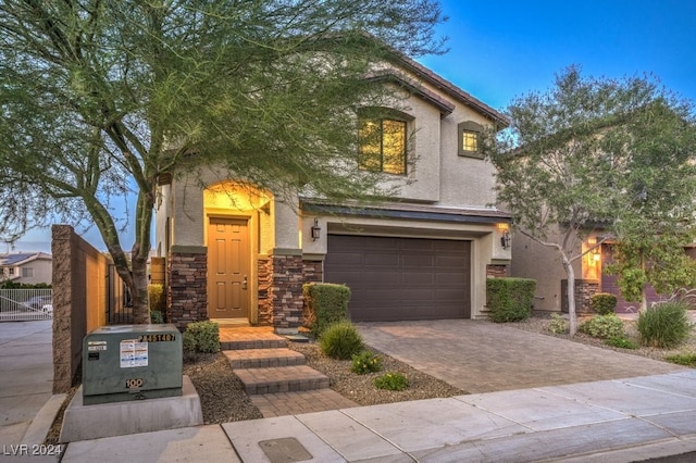 mediterranean / spanish-style home featuring a garage