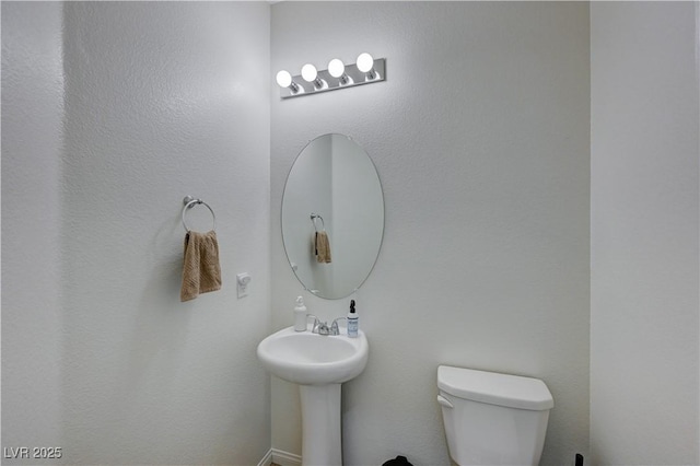 bathroom with sink and toilet