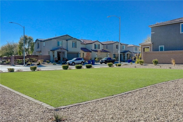 view of home's community featuring a lawn