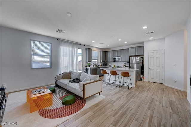 living room featuring light wood-type flooring